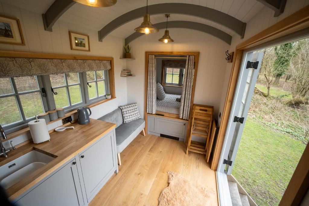 A modern wooden interior with grey cabinets