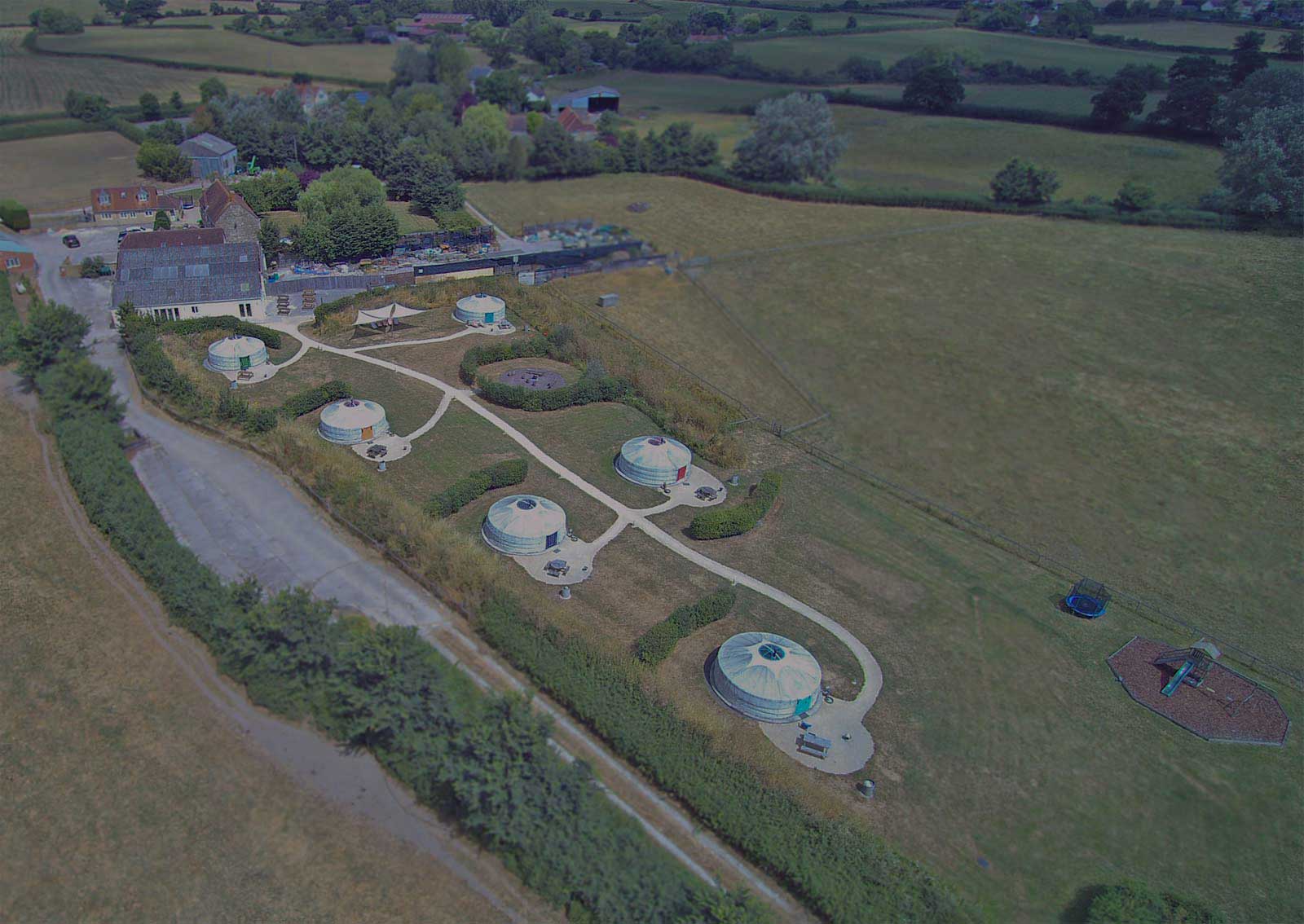 Claam Camp - aerial view of 10 custom yurt tents